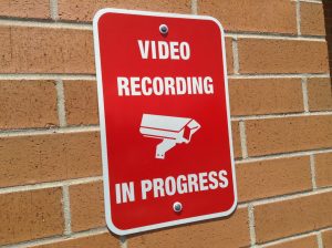 Sign that reads "video recording in progress"